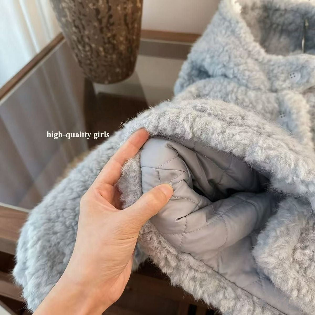 A children's boa coat with an eye-catching shark design 